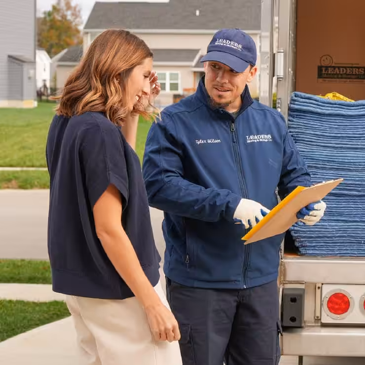 Leaders employee reviewing a quote with a client.