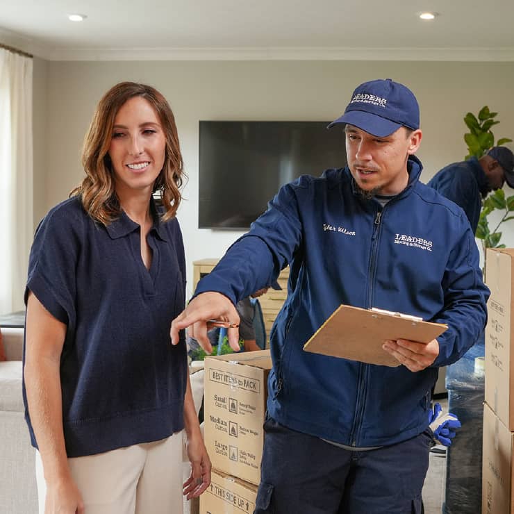 A Leaders team member walking a customer through the process.