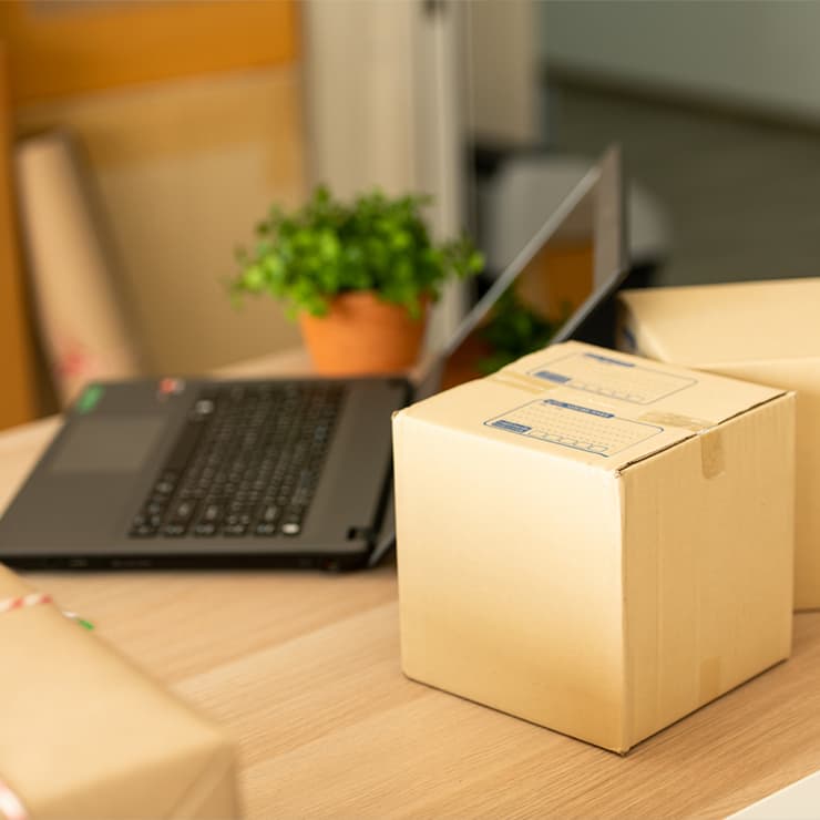 stacked boxes with a laptop on top of them